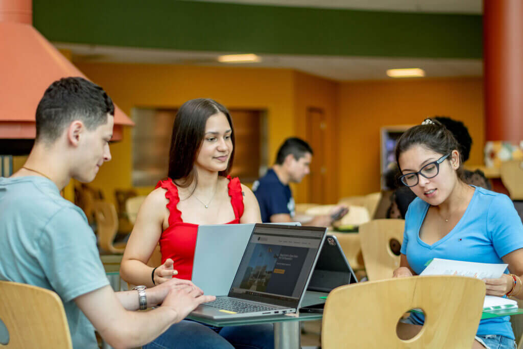 NCC students working together at a table