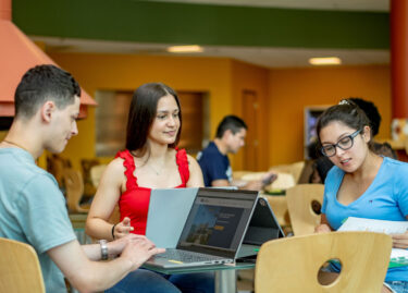 NCC students working together at a table
